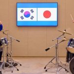 Japanese and South Korean leaders bang out surprise K-pop drum duet